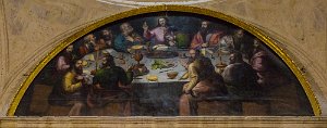 A "Last Supper" painting that features Peruvian food - a guinea pig, chile peppers and corn